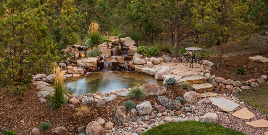 newly upgraded small pond with stone formations